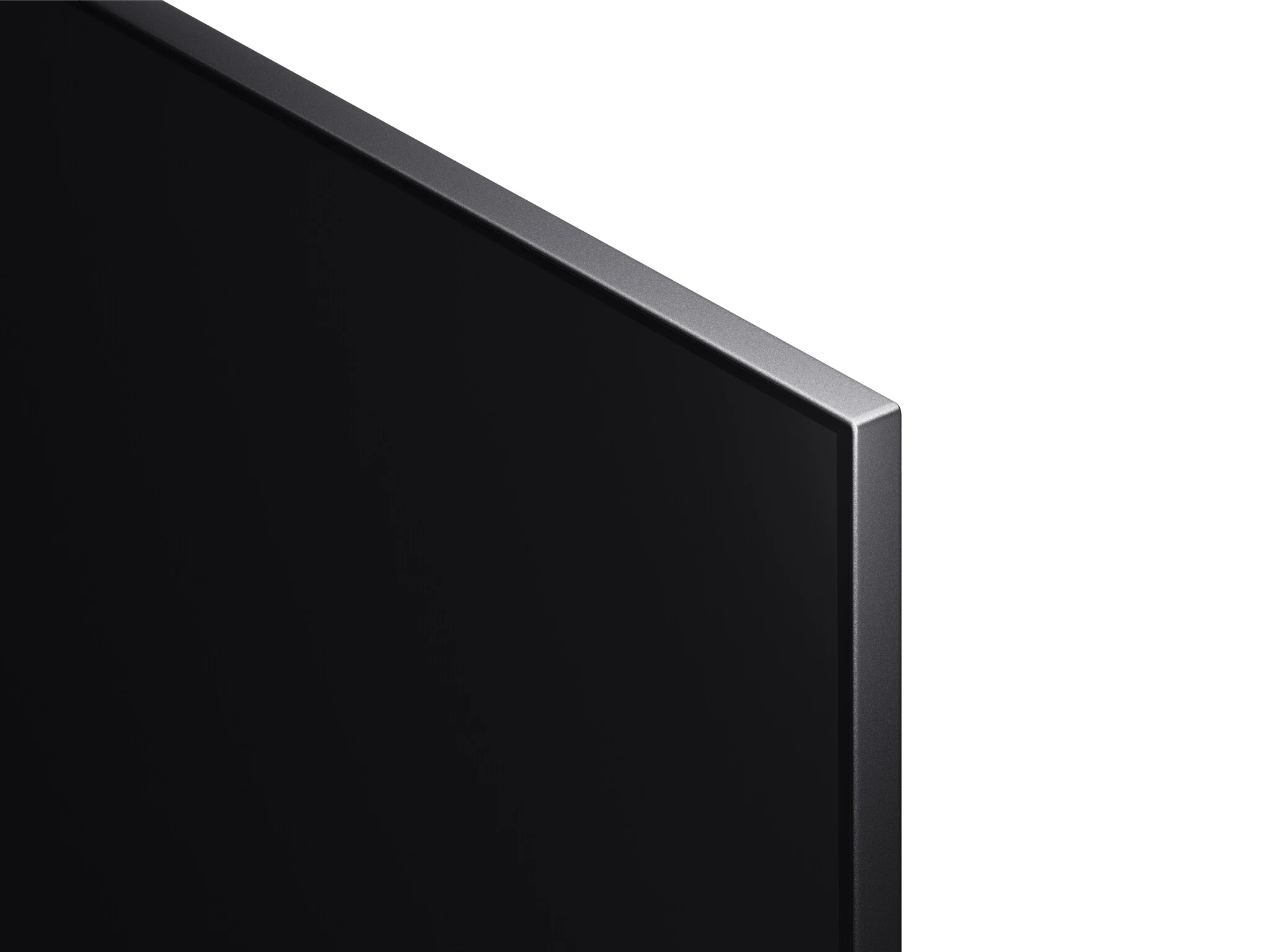 Czarny róg telewizora ze srebrnym wykończeniem na białym tle.