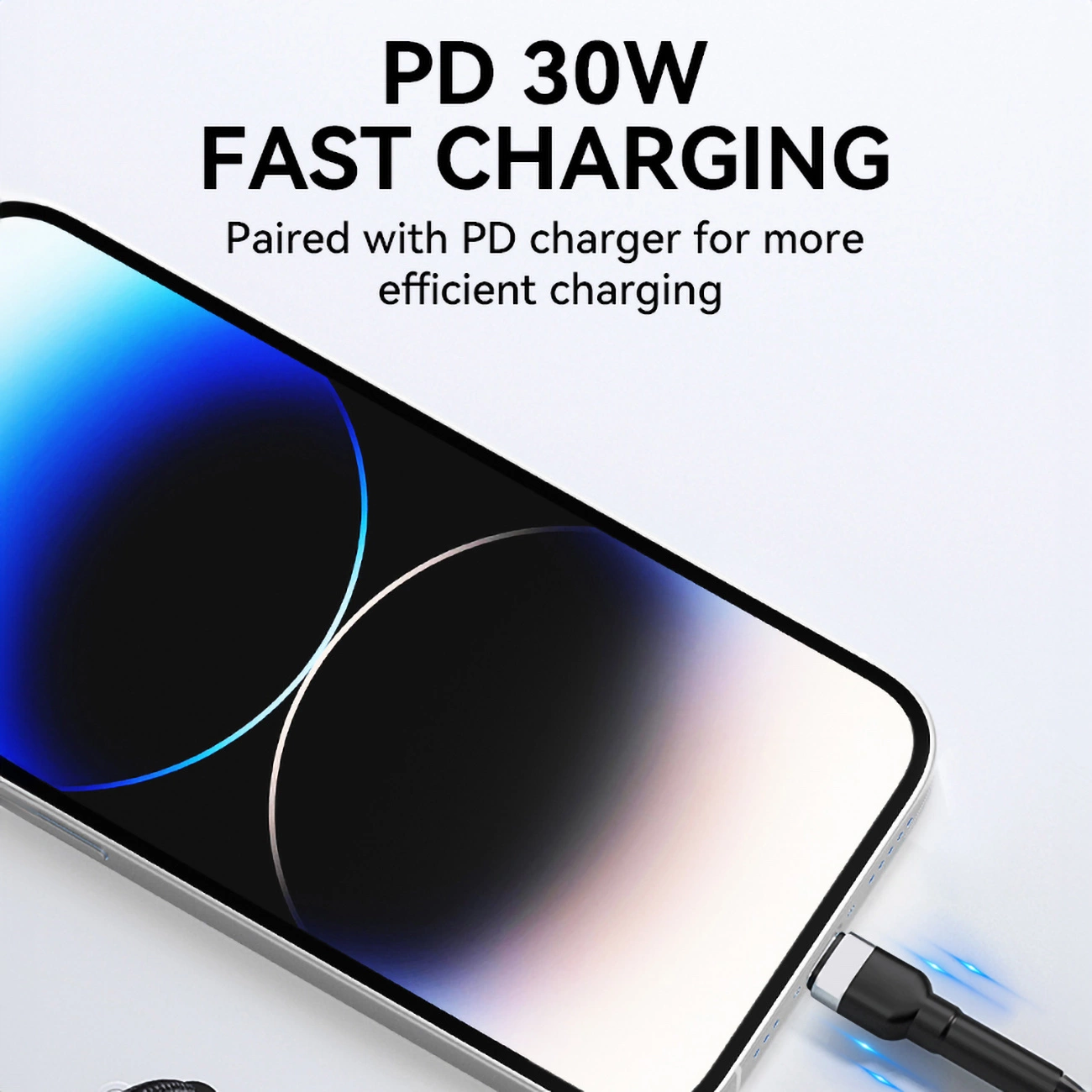 Telefon jest ładowany czarnym kablem. Tekst brzmi 'PD 30W FAST CHARGING'. Ekran ma niebieskie i białe gradienty.