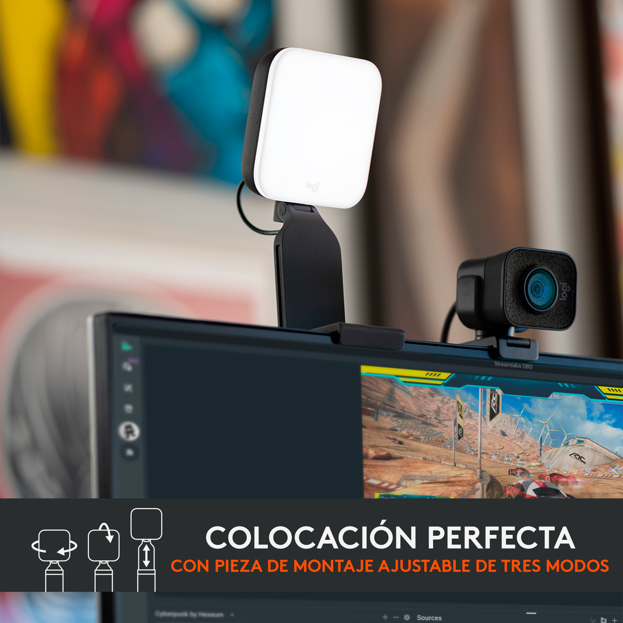 Configuración de webcam con una luz y un monitor de computadora que muestra un juego.