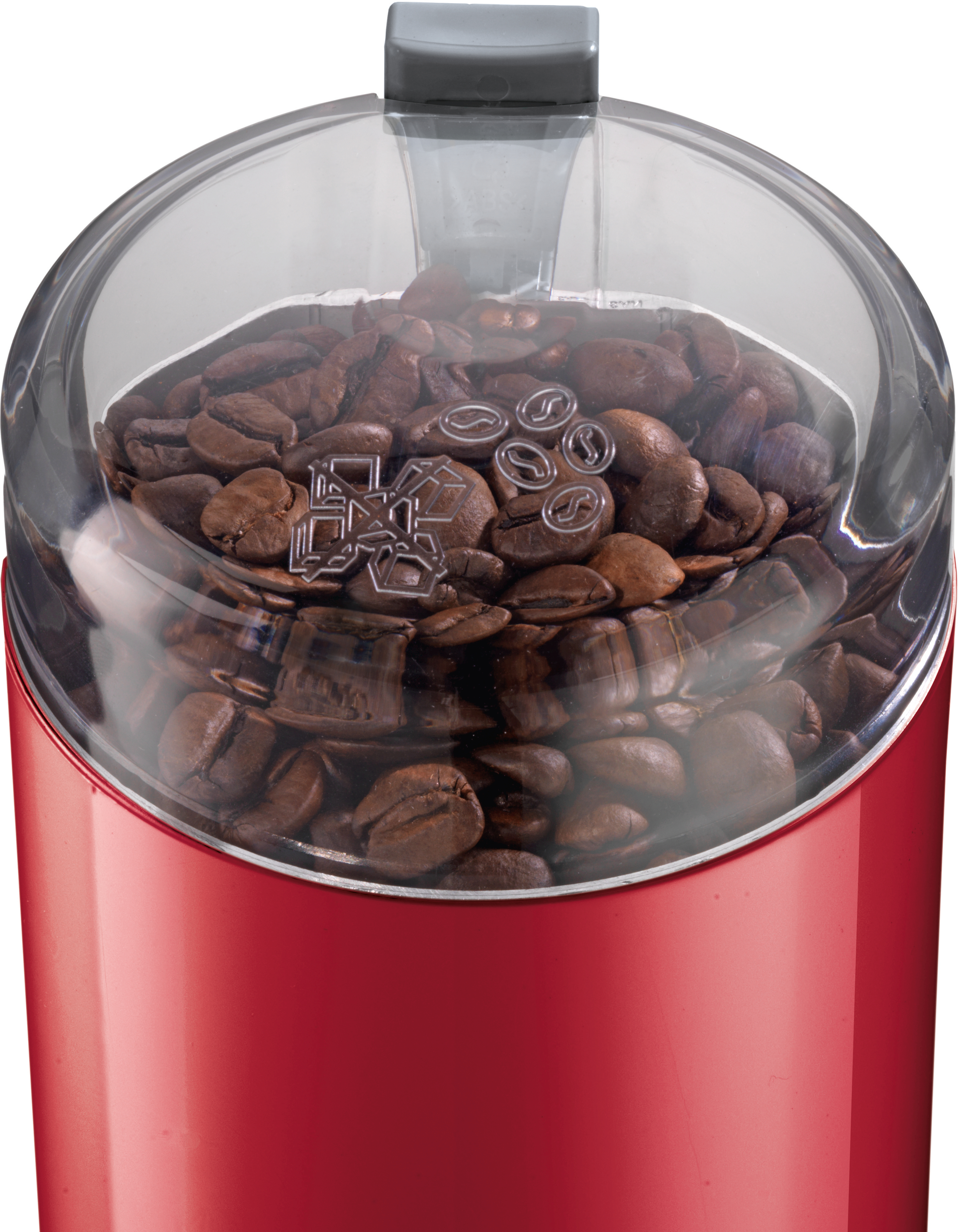 Rote Kaffeemühle mit transparentem Deckel, gefüllt mit Kaffeebohnen, zeigt den Mahlmechanismus.