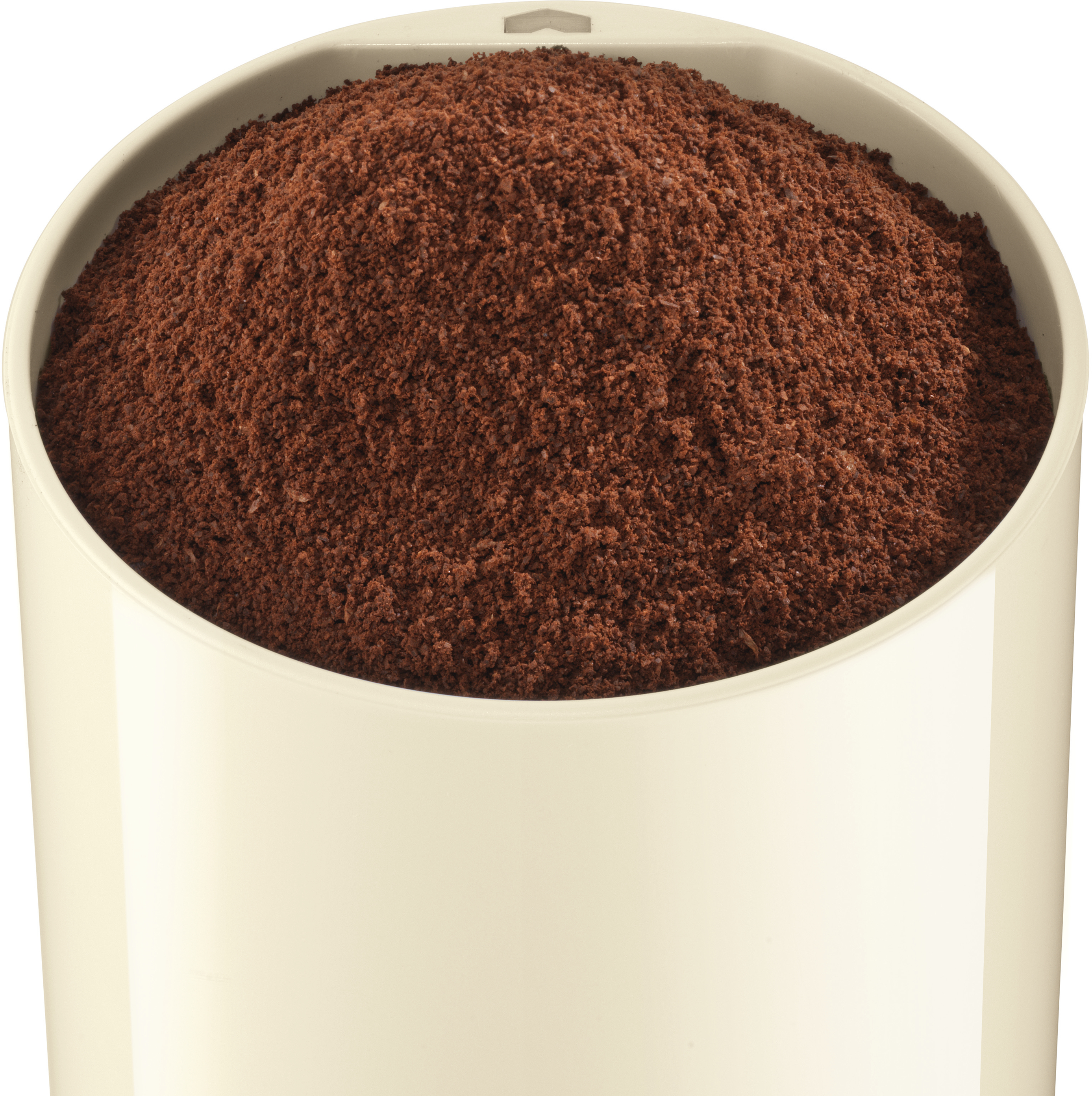 Behälter gefüllt mit braunem Kaffeepulver. Beige Farbe.