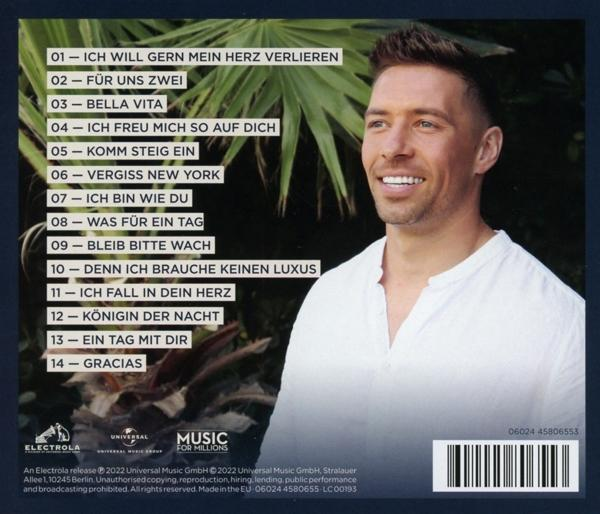 Albumcover mit lächelndem Mann, Titelliste auf der Rückseite.