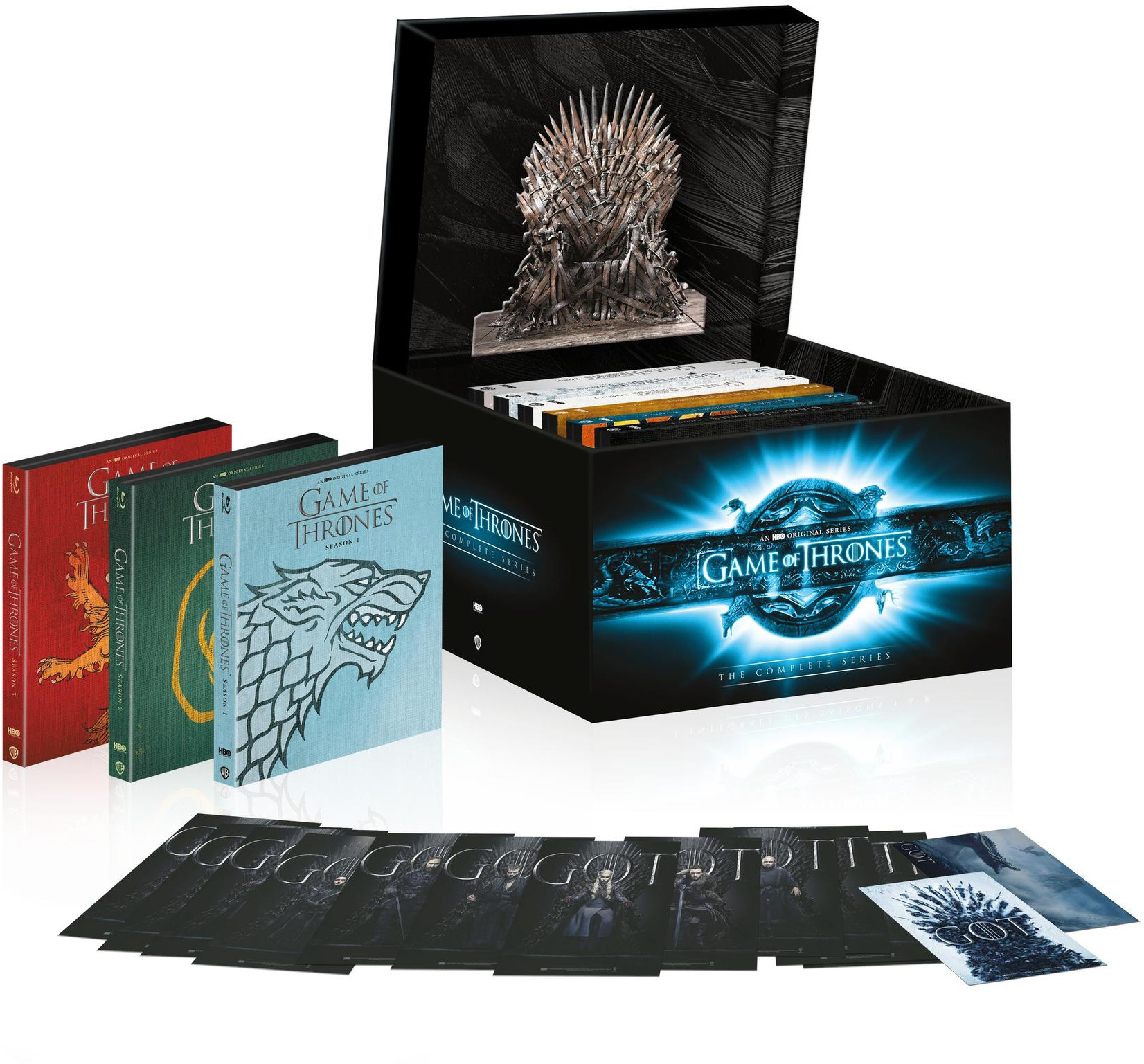 Coffret Game of Thrones avec DVD, livres et un Trône de Fer miniature.