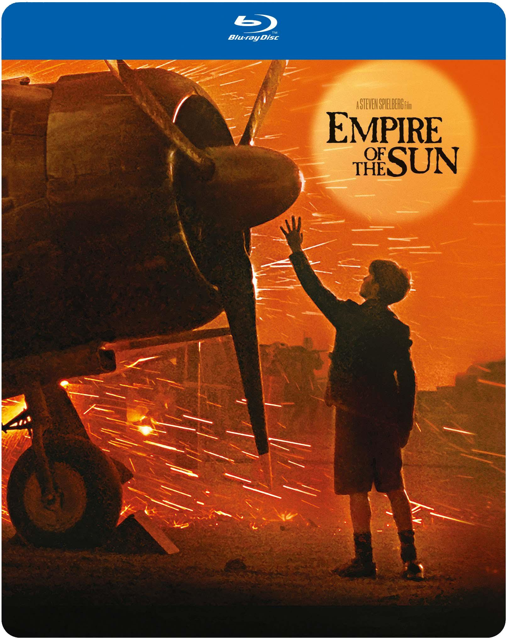Couverture du film 'Empire of the Sun' avec un garçon et un avion en feu.