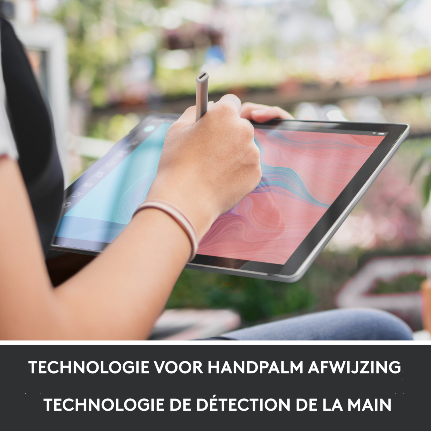 Person using a stylus on a tablet, with text about palm rejection.