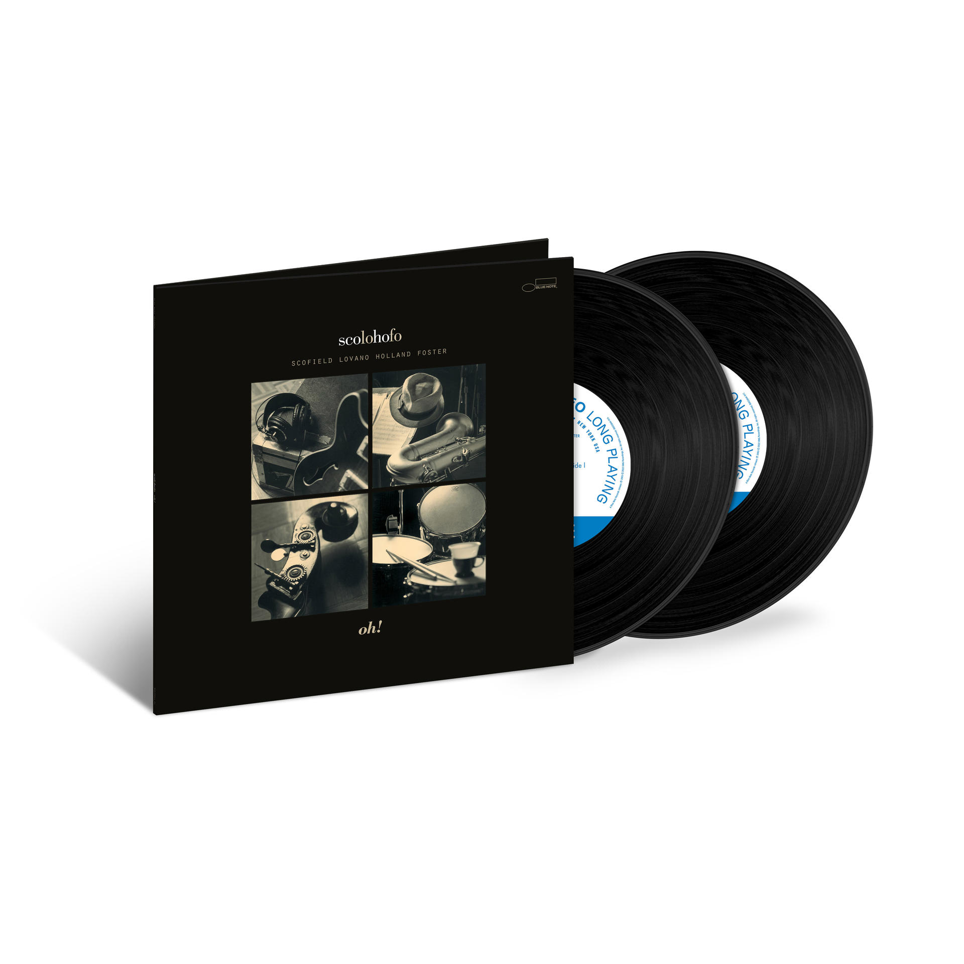 Albumcover mit Schallplatten. Cover: schwarz, vier Fotofelder, Text. Platten: schwarz, Etiketten.