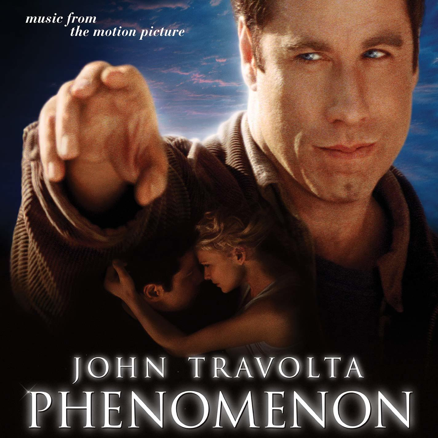 Filmplakát John Travoltával és egy párral. A cím: 'PHENOMENON'.