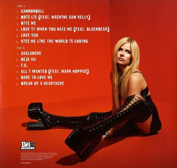 Rückseite eines Albums mit einer Frau in schwarzen Stiefeln und rotem Hintergrund.