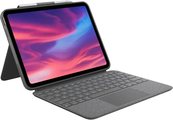 An open tablet with keyboard and stylus, on a gray fabric surface.
