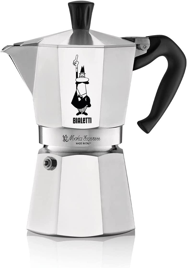 Silberner Bialetti Moka Express Kaffeekocher mit schwarzem Griff und einer Cartoonfigur.