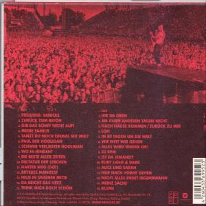 Rückseite einer CD mit Bühne und Publikum, mit deutschen Songtiteln und Text.