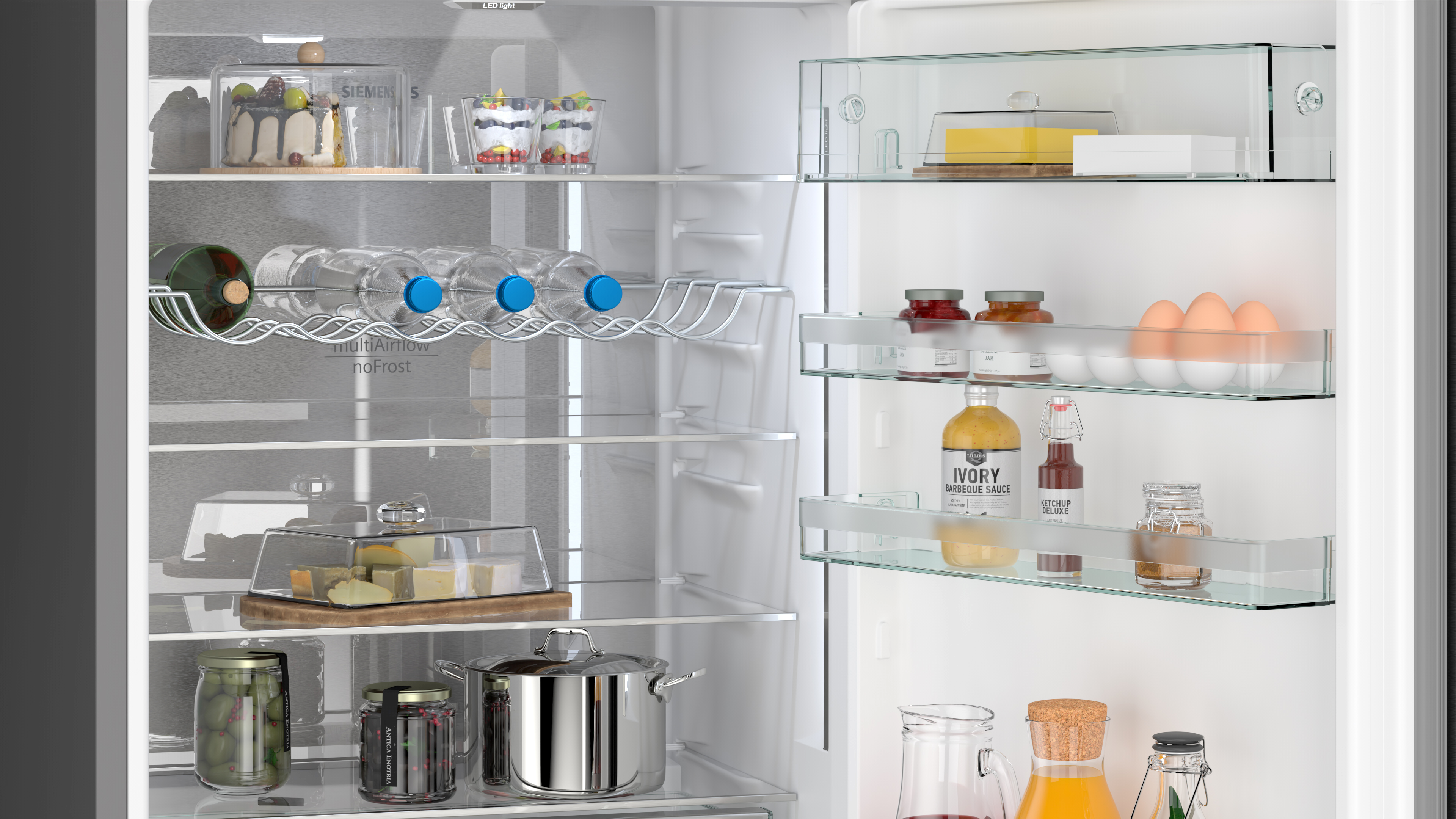 Refrigerator interior with shelves holding food items like eggs, wine and condiments.