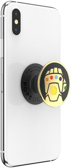 Witte smartphone met een zwarte Popsocket met een gouden handschoen.