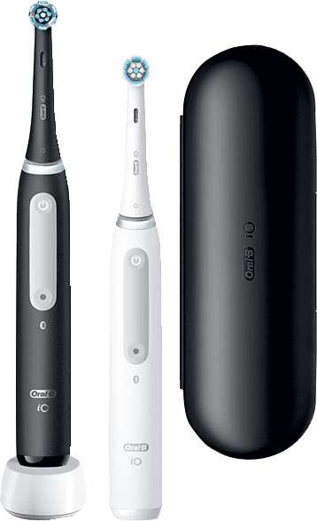 Deux brosses à dents électriques, une noire, une blanche. Un étui de voyage noir à côté.