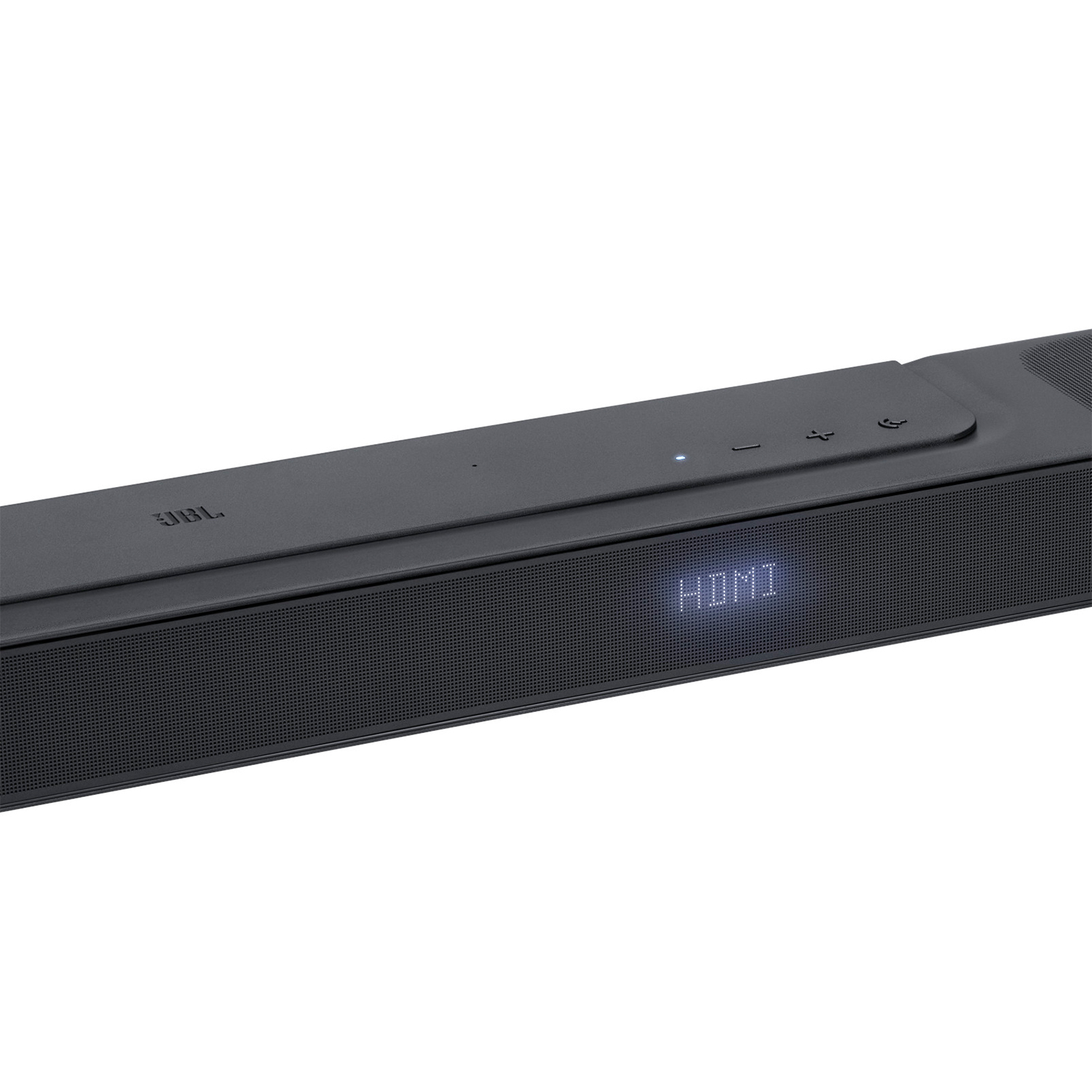 Soundbar JBL nera con display HDMI, su superficie bianca.
