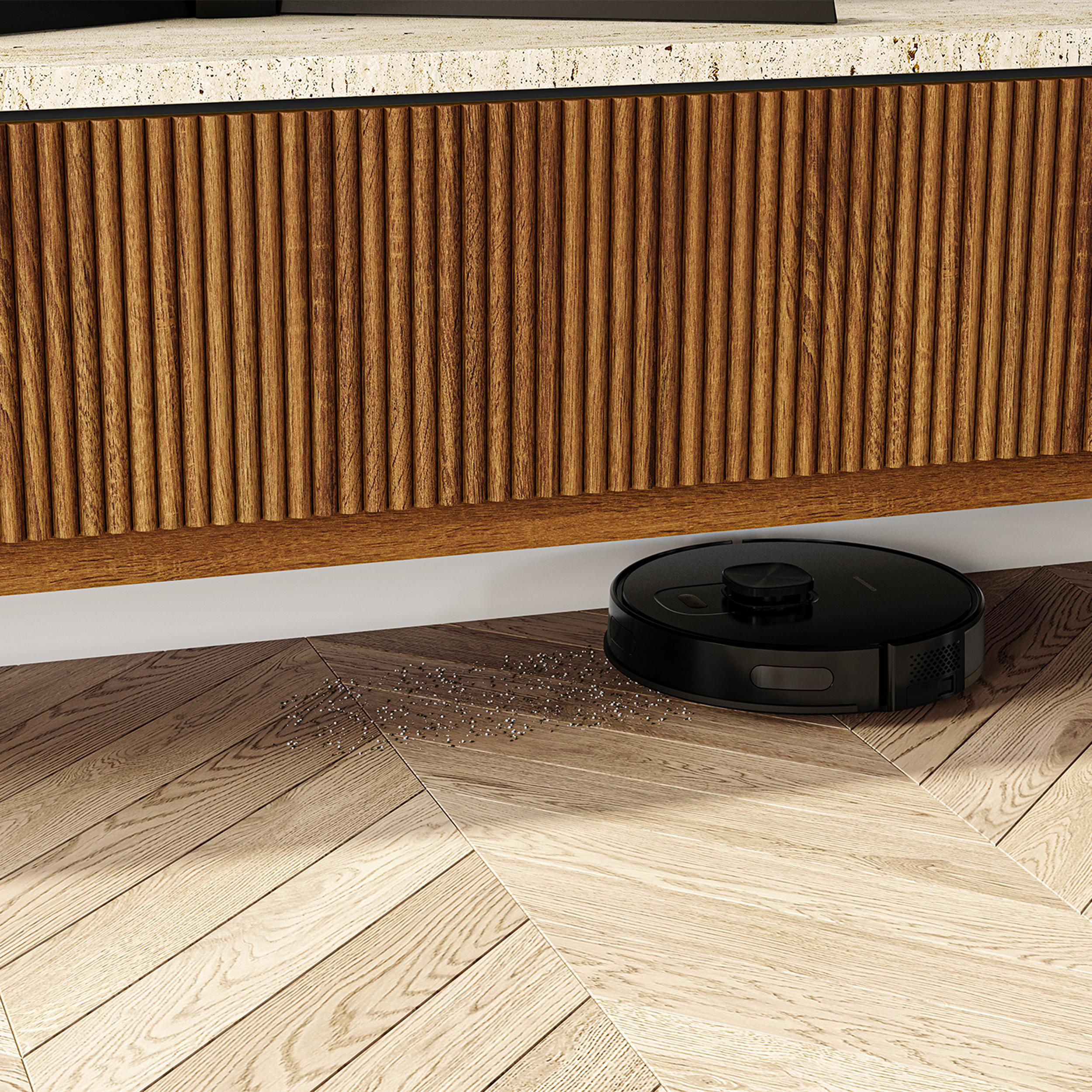 Ein Roboter-Staubsauger reinigt einen Holzboden.