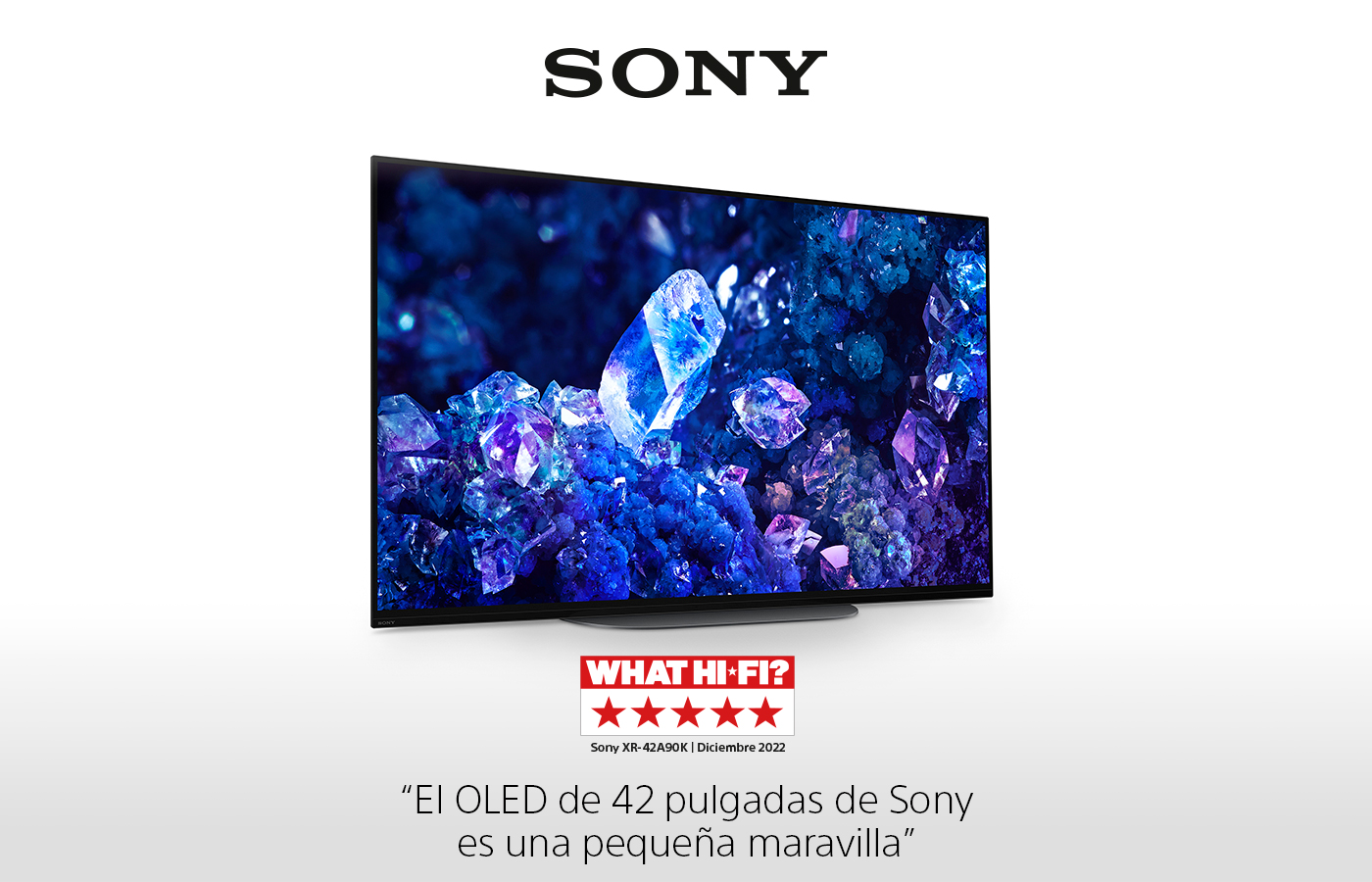 TV OLED Sony con cristales azules en pantalla. Logo Sony arriba. Reseña 'What Hi-Fi?' abajo.