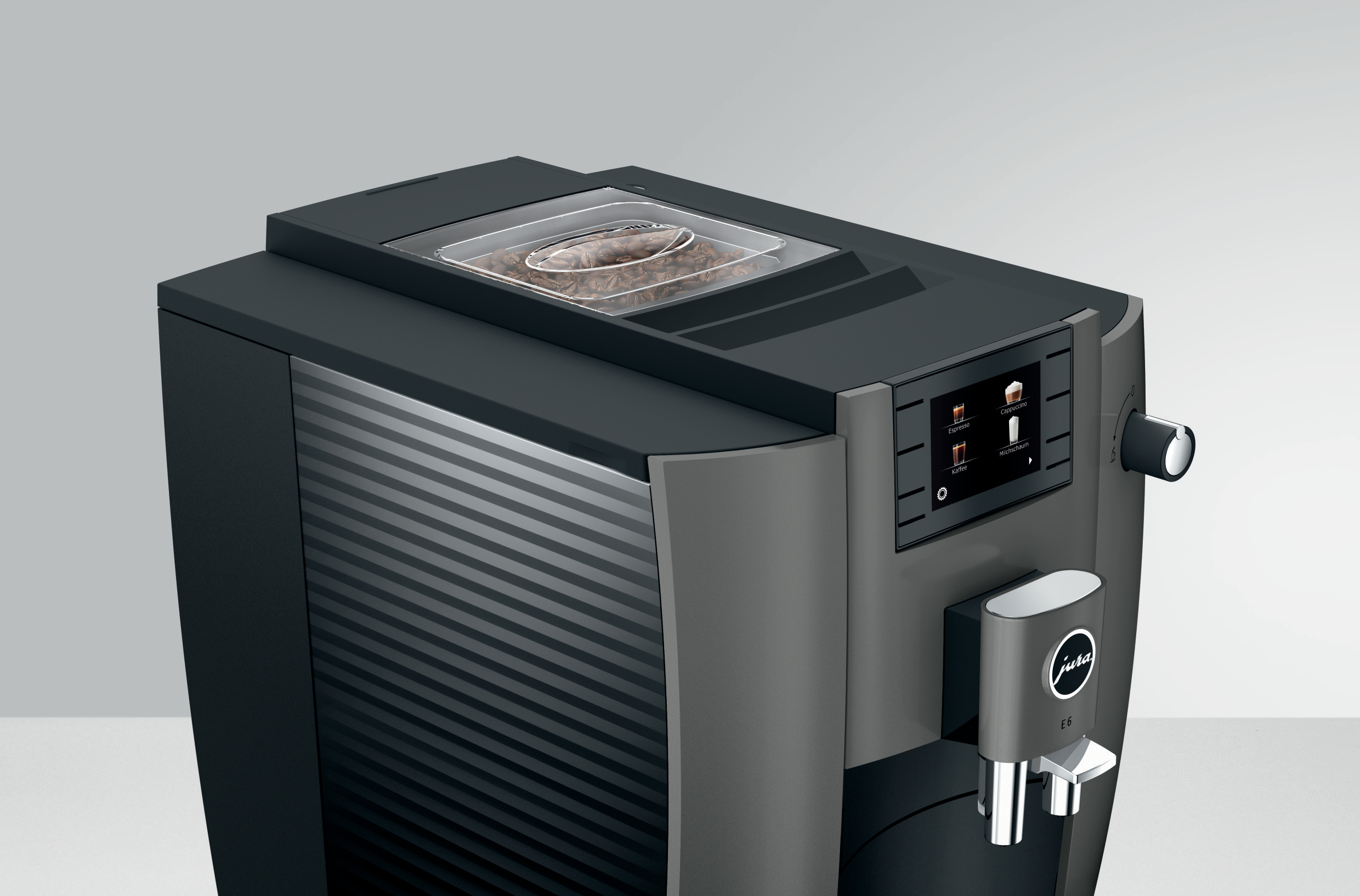 Schwarze und graue Jura Kaffeemaschine mit transparentem Bohnenbehälter. Knöpfe und Display.
