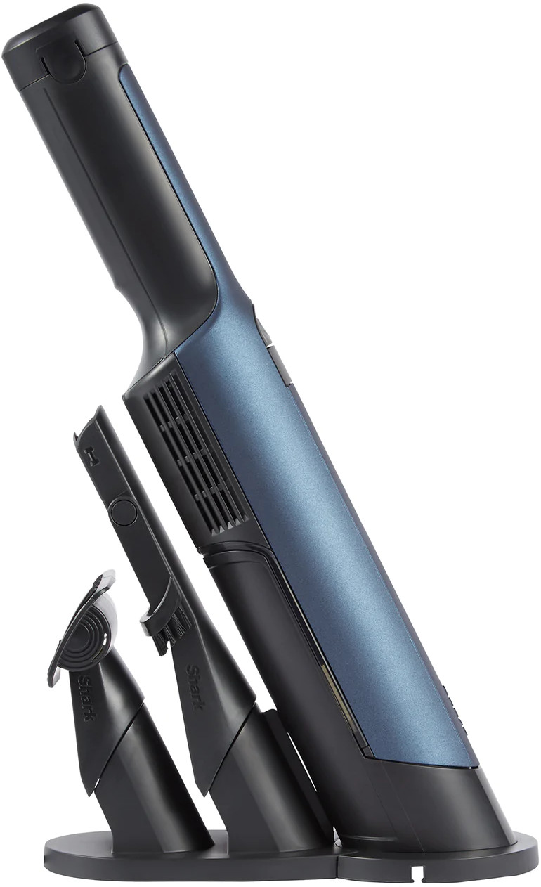 Un aspirateur à main Shark bleu et noir avec des accessoires.