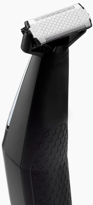 Close-up of a black body groomer. The blade is visible. The handle has a textured pattern.