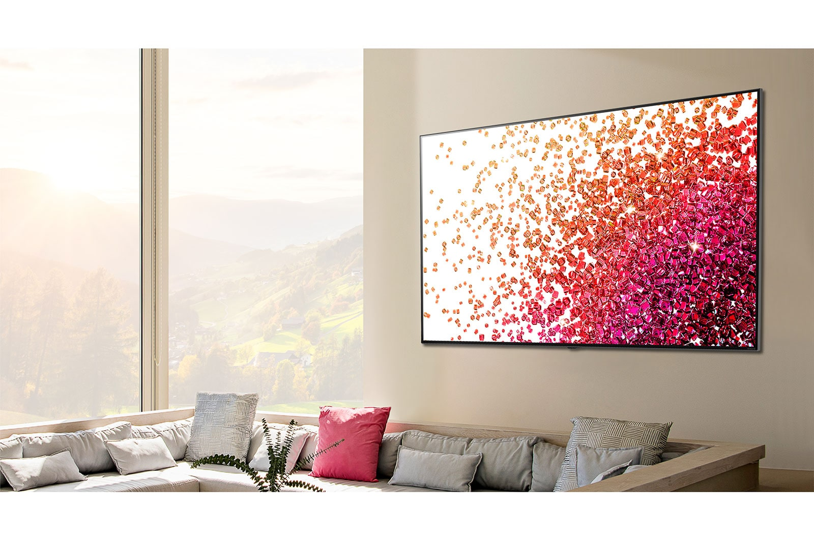 Oturma odasında duvarda büyük bir TV. Ekran soyut bir tasarım görüntülüyor.
