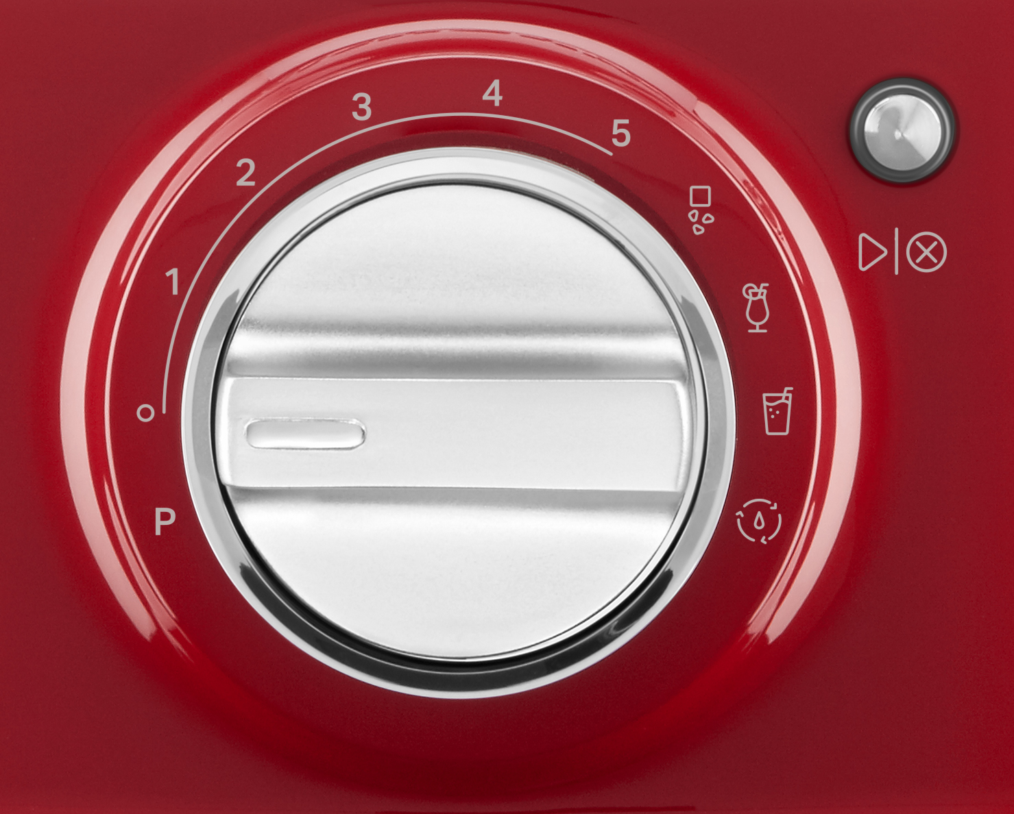 Dial rojo en una máquina con números e iconos. Un botón blanco está en el centro.