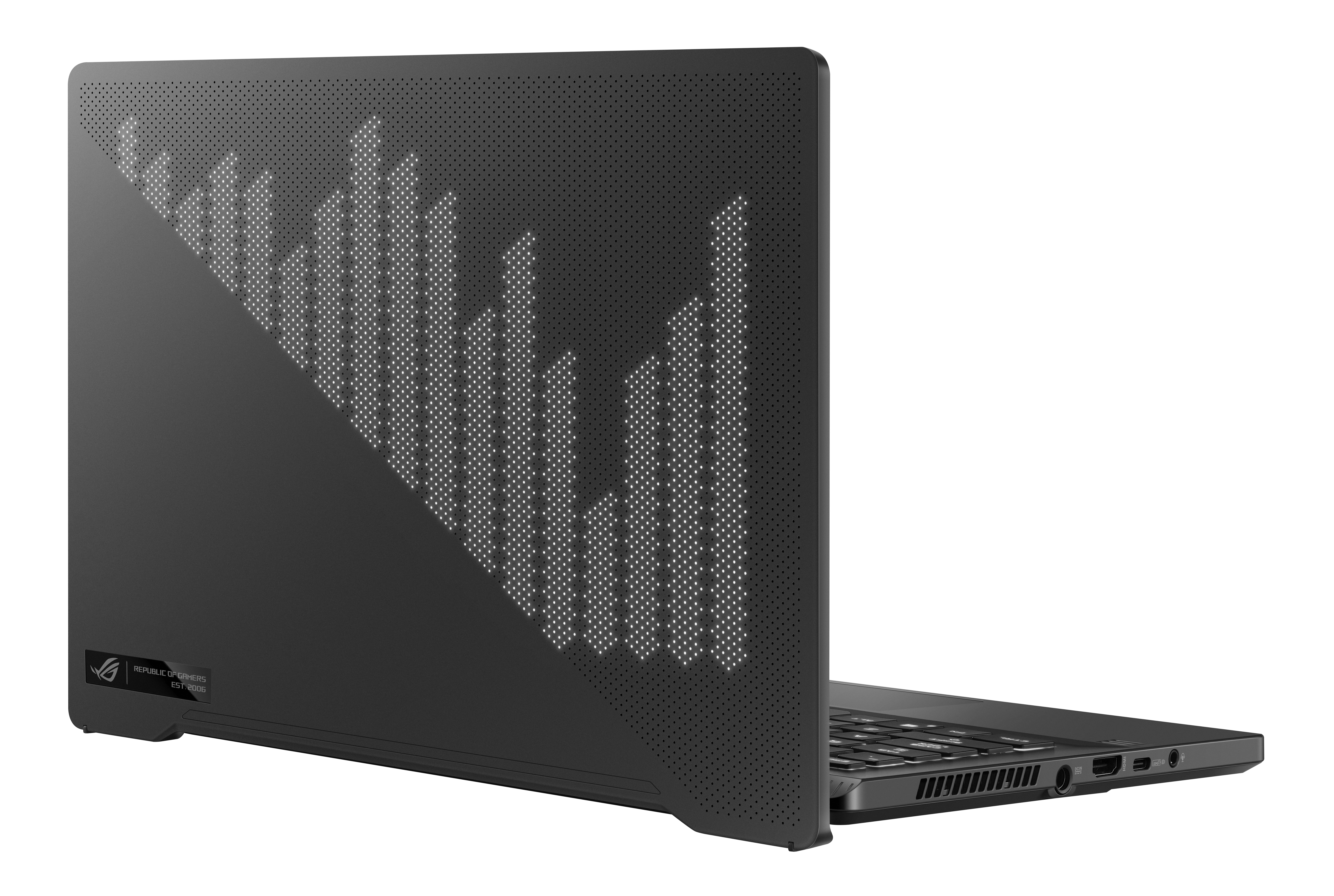 Una computadora portátil negra está abierta. La parte trasera del portátil tiene un diseño decorativo de líneas y puntos.