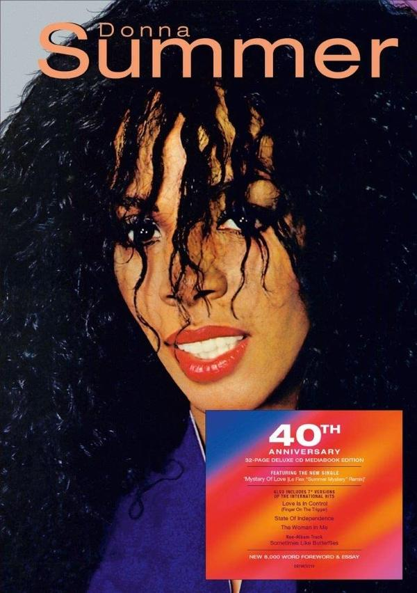 Pochette d'album de Donna Summer. Son visage est en gros plan, avec des cheveux noirs bouclés et du rouge à lèvres.