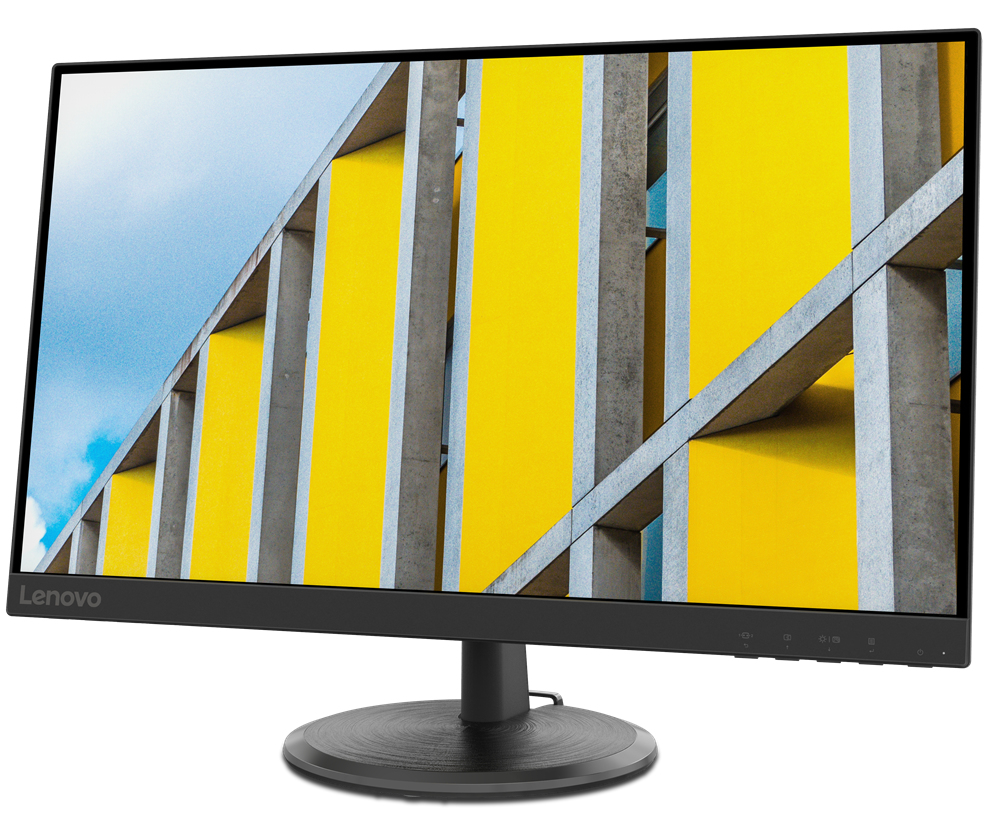 Monitor de computadora con un patrón geométrico amarillo y gris. Marco y base negros. Fondo de cielo azul.