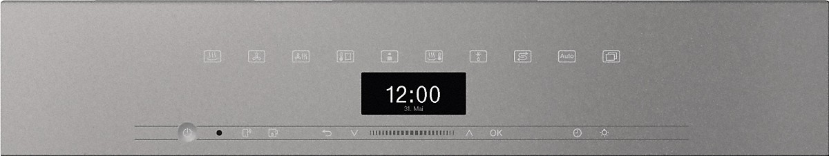 Ein silbernes Gerätebedienfeld mit einer Digitaluhr, die 12:00 Uhr anzeigt. Mehrere Symbole und ein Netzschalter sind sichtbar.
