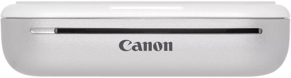 A Canon photo printer, top view, silver-colored, with the Canon logo visible.