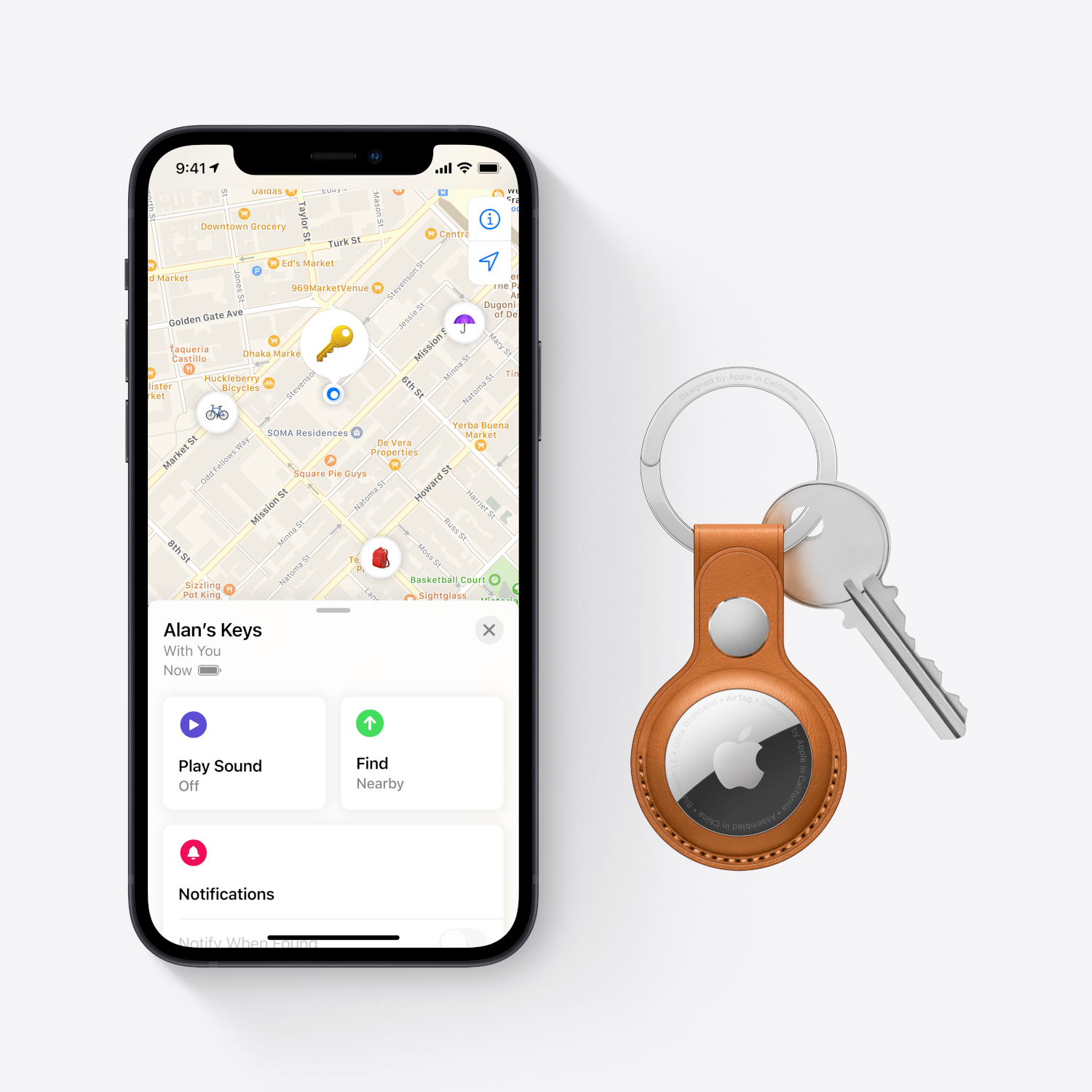 A smartphone displays a map and AirTag with keys. A key ring with AirTag is on the right.