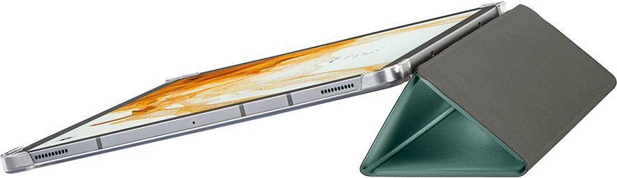 A silver tablet in a case, propped up on a green triangular base.