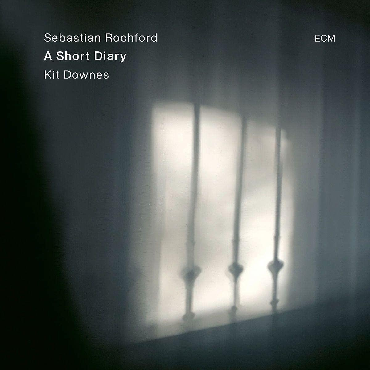 Albumcover mit einem verschwommenen Bild eines Fensters und Gittern. Text: 'A Short Diary' und 'Sebastian Rochford'.