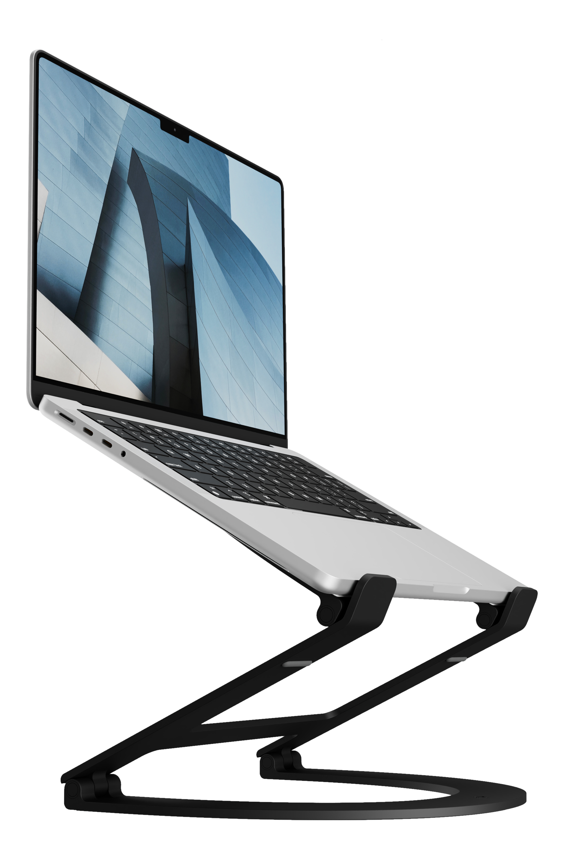 Ein Laptop auf einem schwarzen Ständer. Der Bildschirm zeigt ein modernes Gebäude mit blauem Himmel.