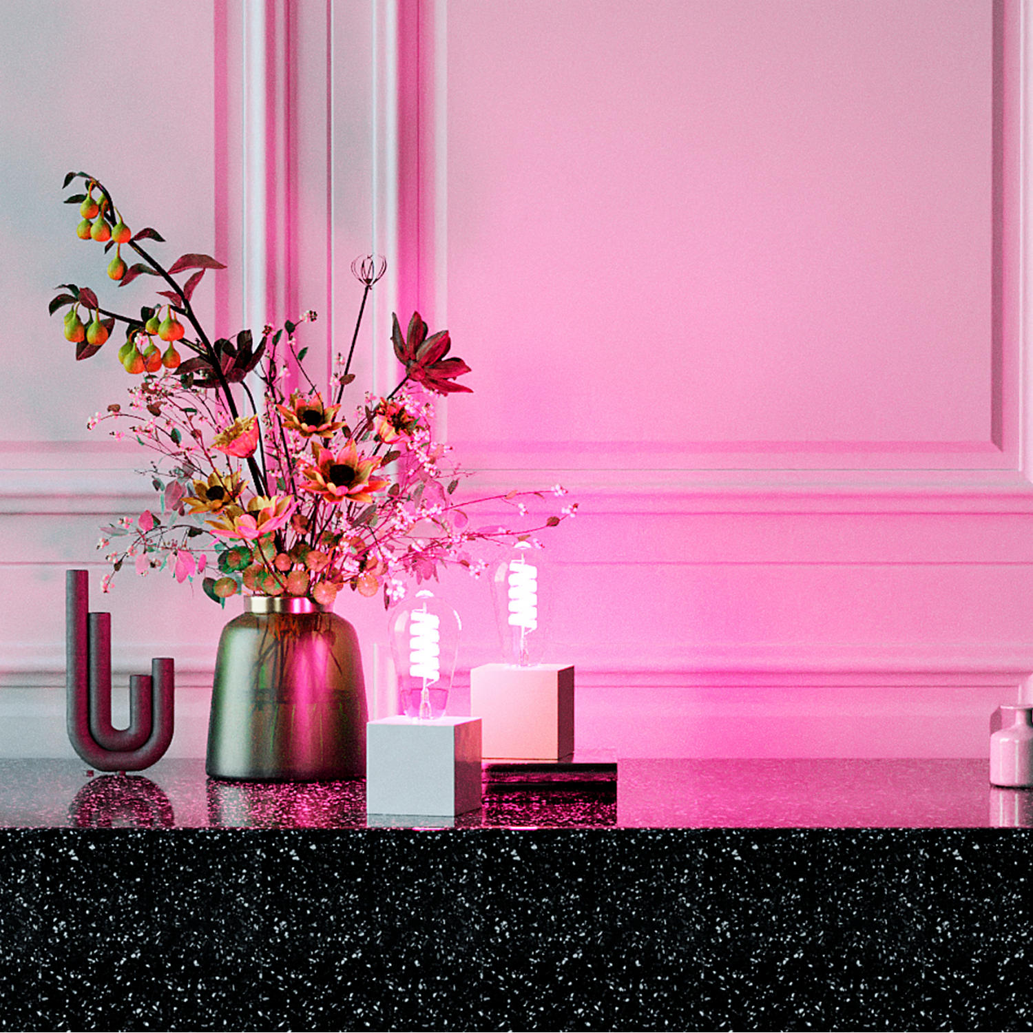 A floral arrangement and two light bulbs on a pink background. The setting is a table.