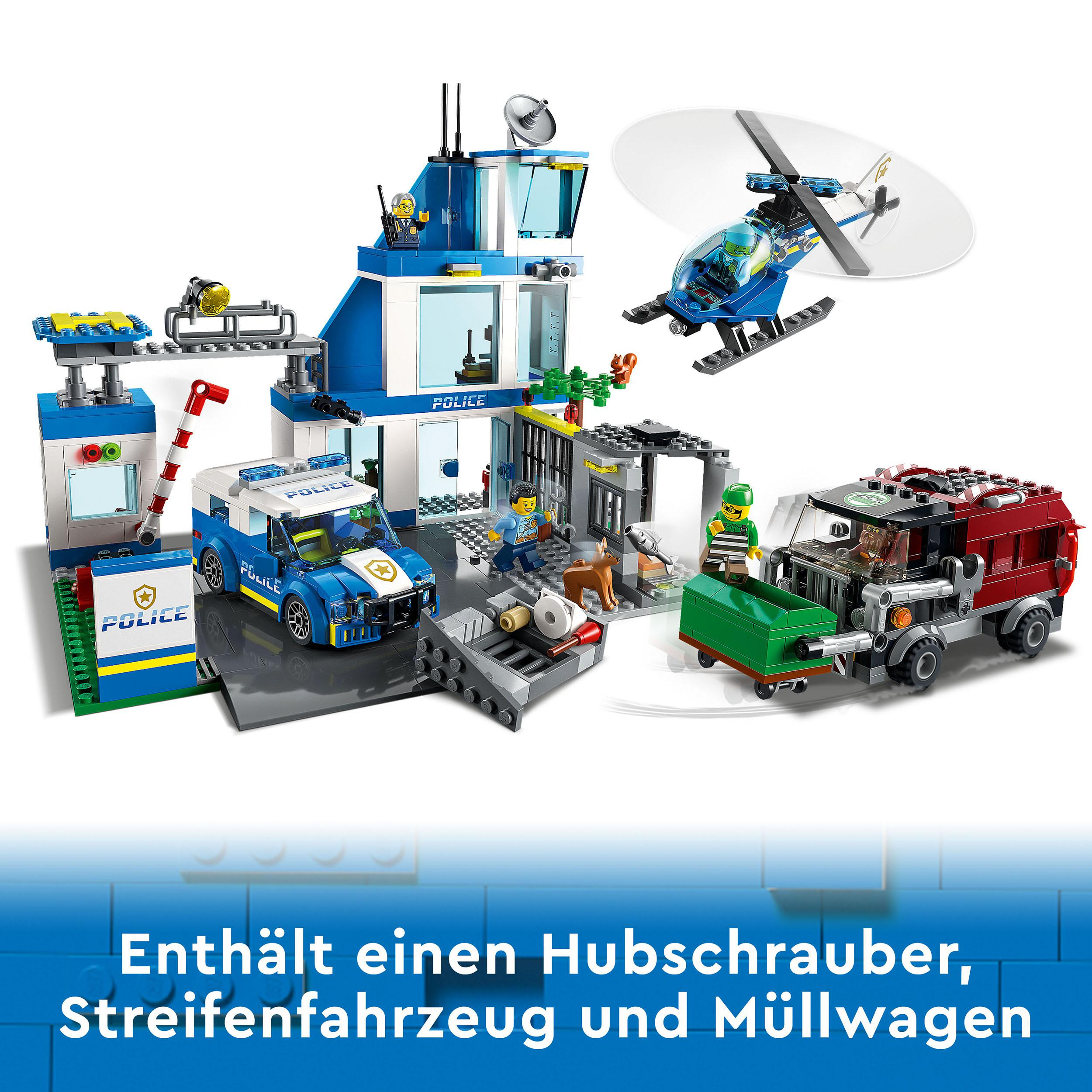 Lego Polizeistation Set mit Hubschrauber, Polizeiauto, Gefängnis, Figuren und einem roten Feuerwehrauto.