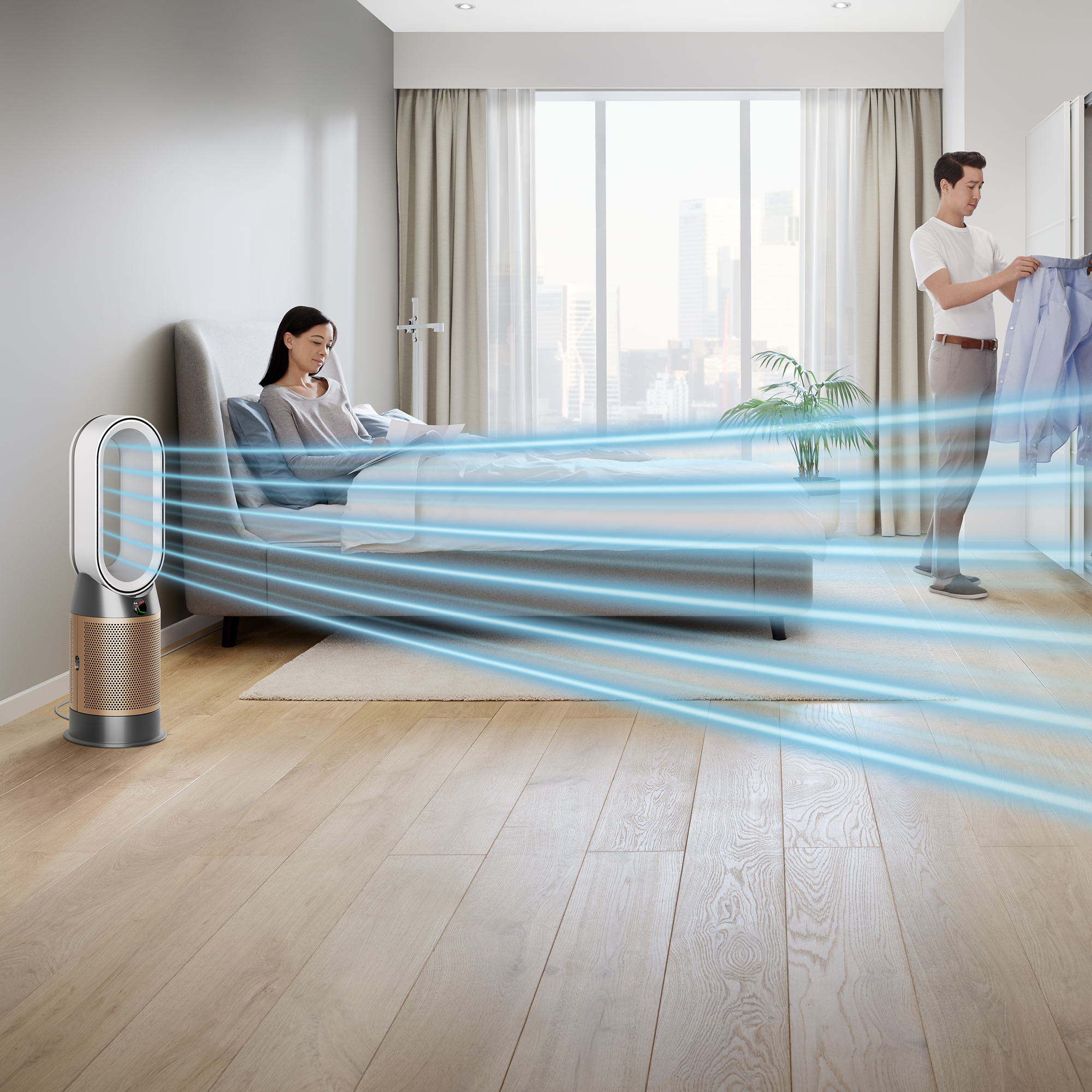 Femme sur le lit, homme près du placard, purificateur d'air Dyson avec des flux d'air bleus. Chambre moderne.