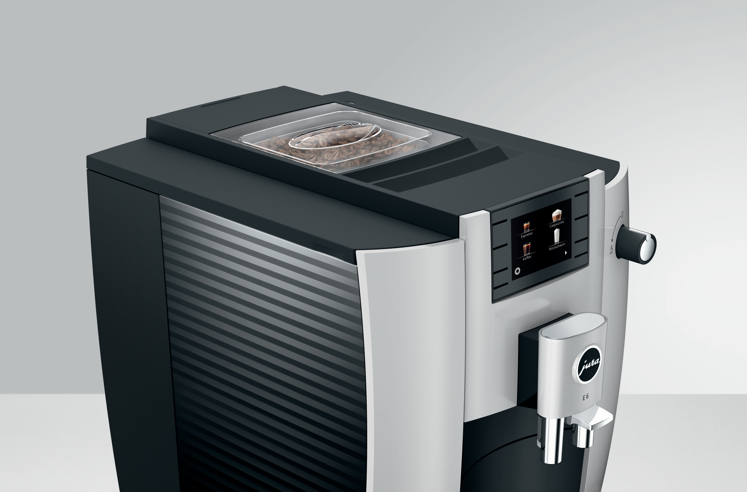 Moderne Espressomaschine mit Bohnen, Touchscreen und Auslauf.