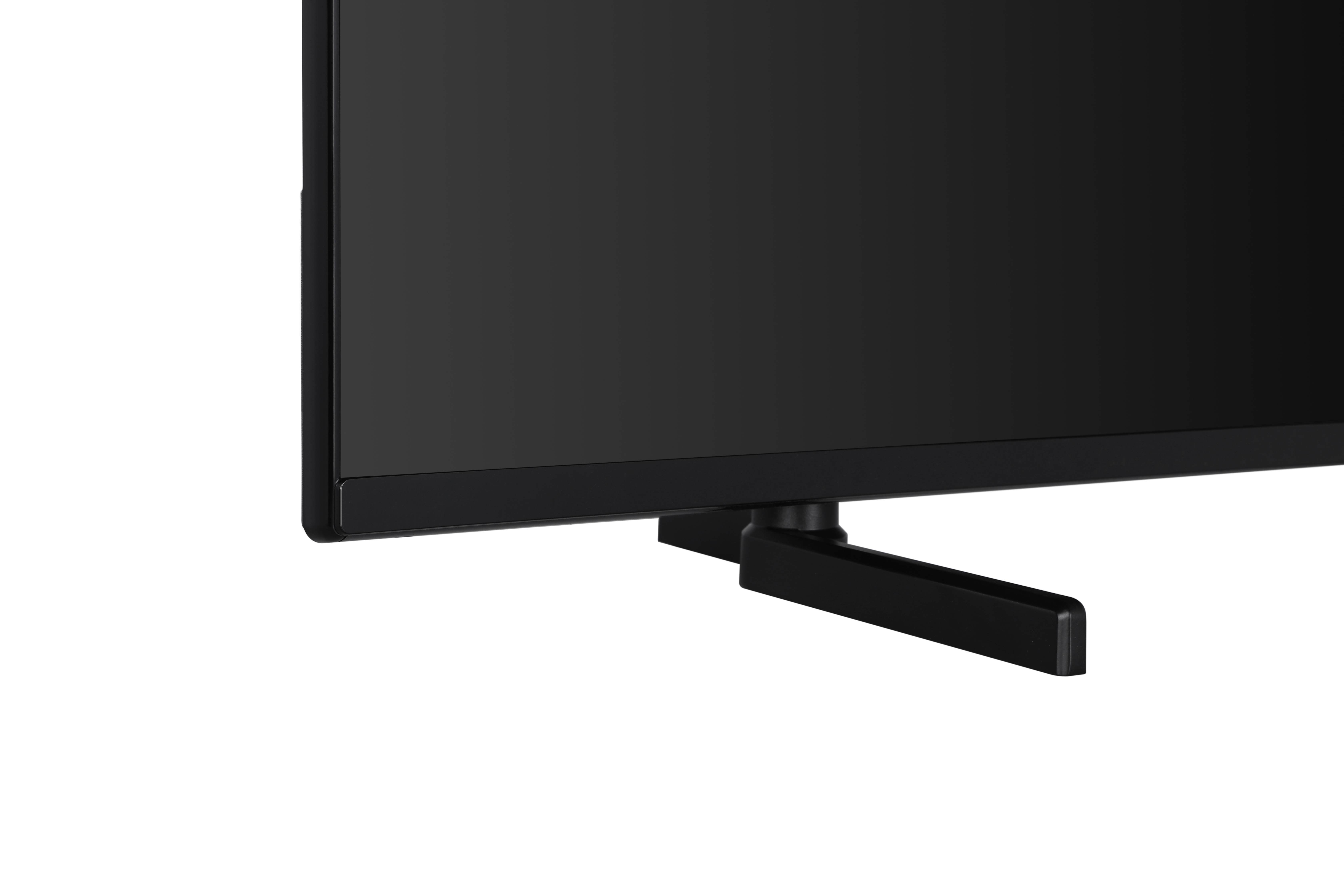 Siyah bir TV standının ve bir TV ekranının alt kısmının yakın çekimi.