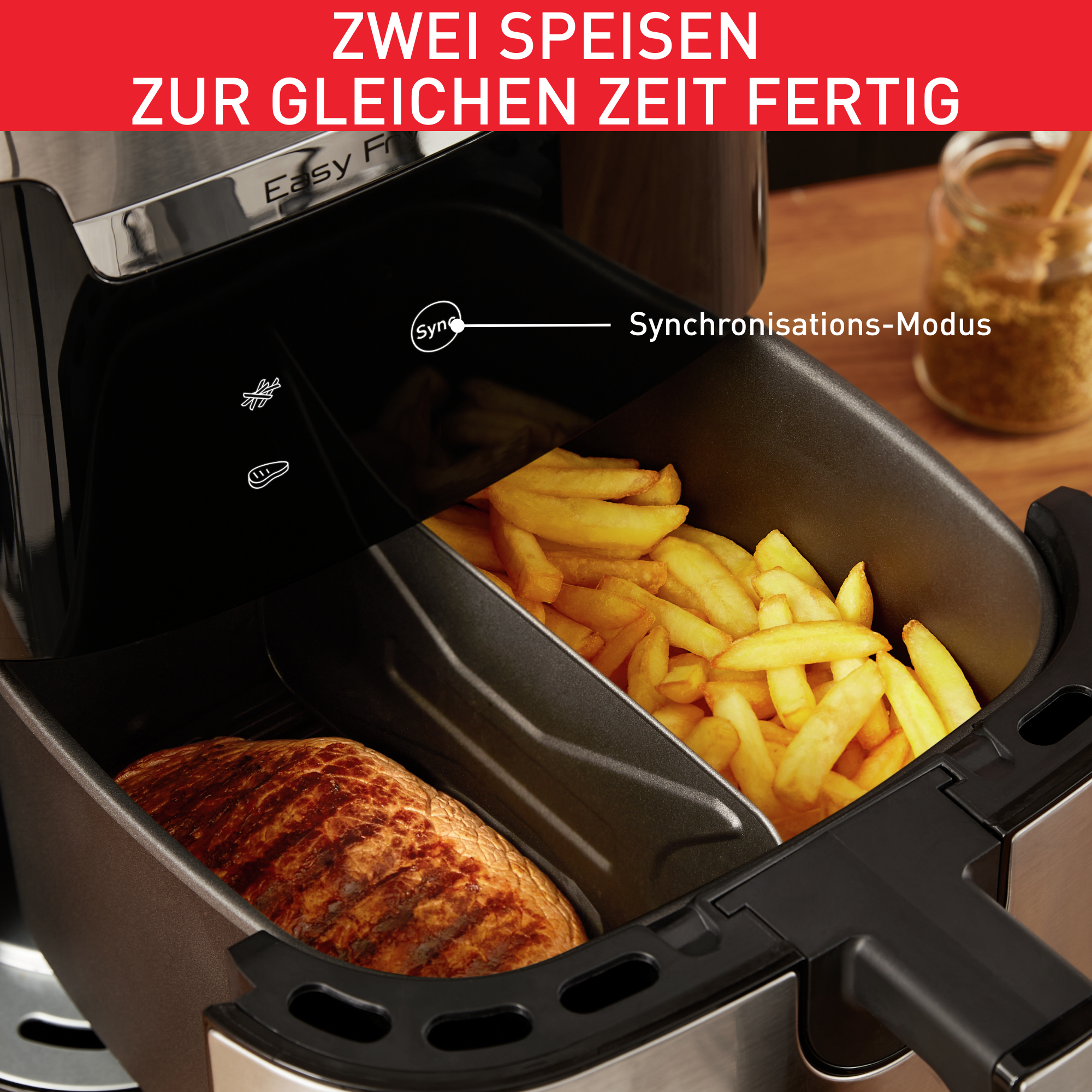 Ein Airfryer mit Pommes und Fleisch. Text: Zwei Gerichte gleichzeitig fertig.