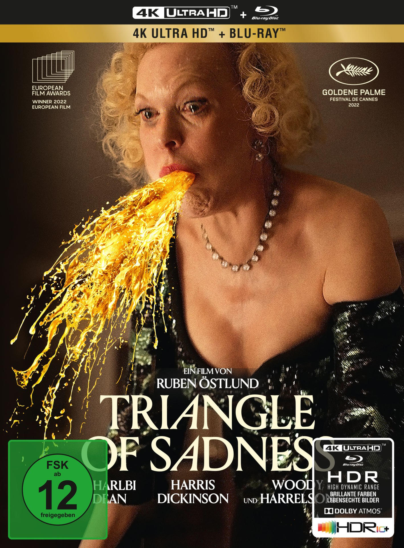 Filmcover von 'Triangle of Sadness'. Eine Frau mit goldenem Erbrochenem, mit Text und Logo.