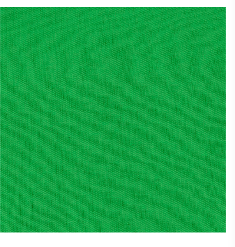 Grüner Stoffhintergrund. Es ist eine einfarbige grüne Farbe.