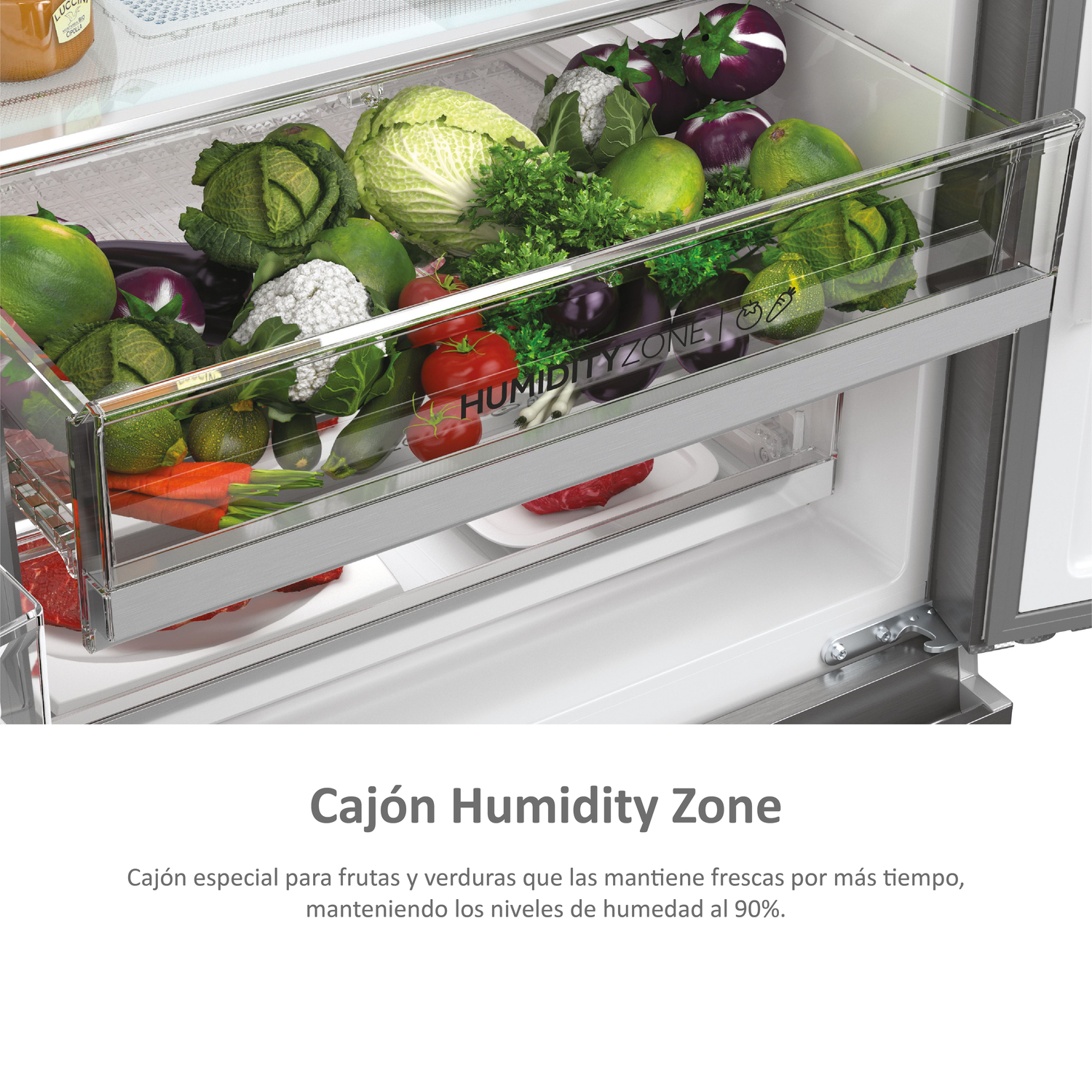 Cajón de nevera con verduras frescas, texto: Cajón Humidity Zone, y texto en español.