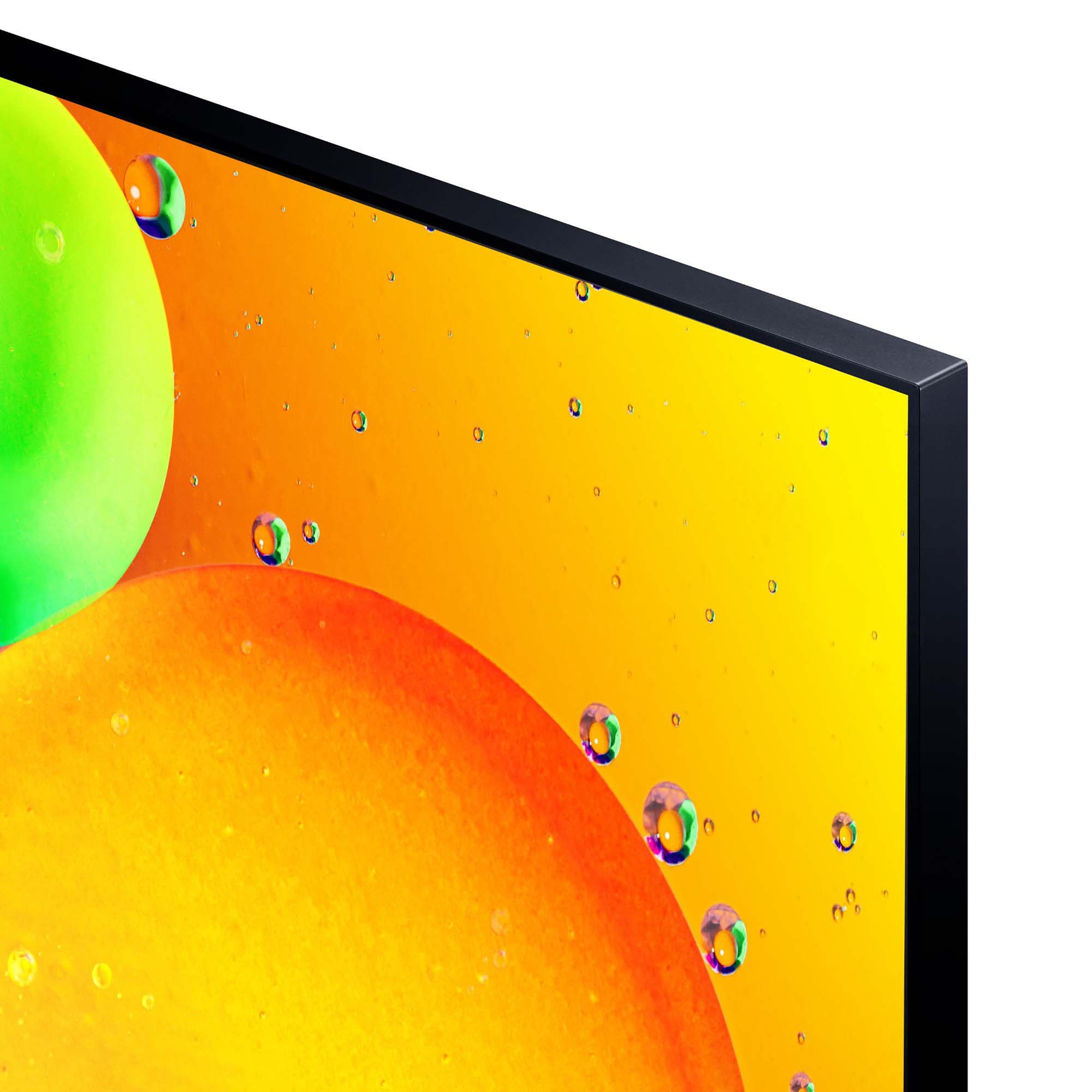 Primer plano de una pantalla de TV con colores vibrantes y abstractos naranja y verde y gotas de agua.