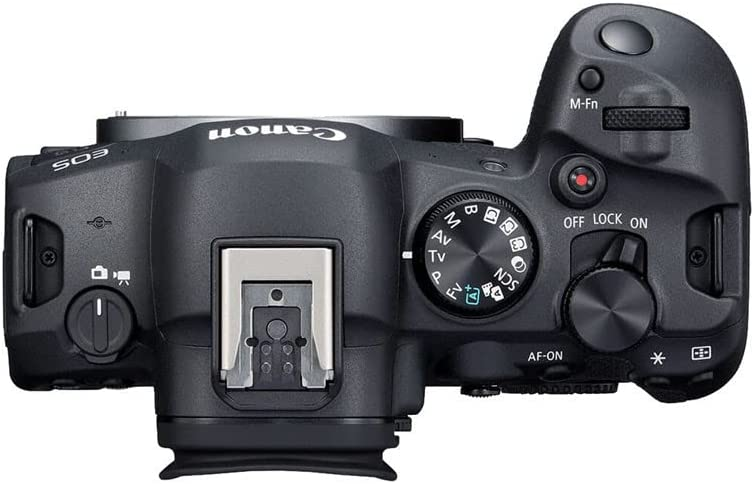 Cámara Canon EOS, vista superior. Cuenta con dial de modo, botones de control y zapata.