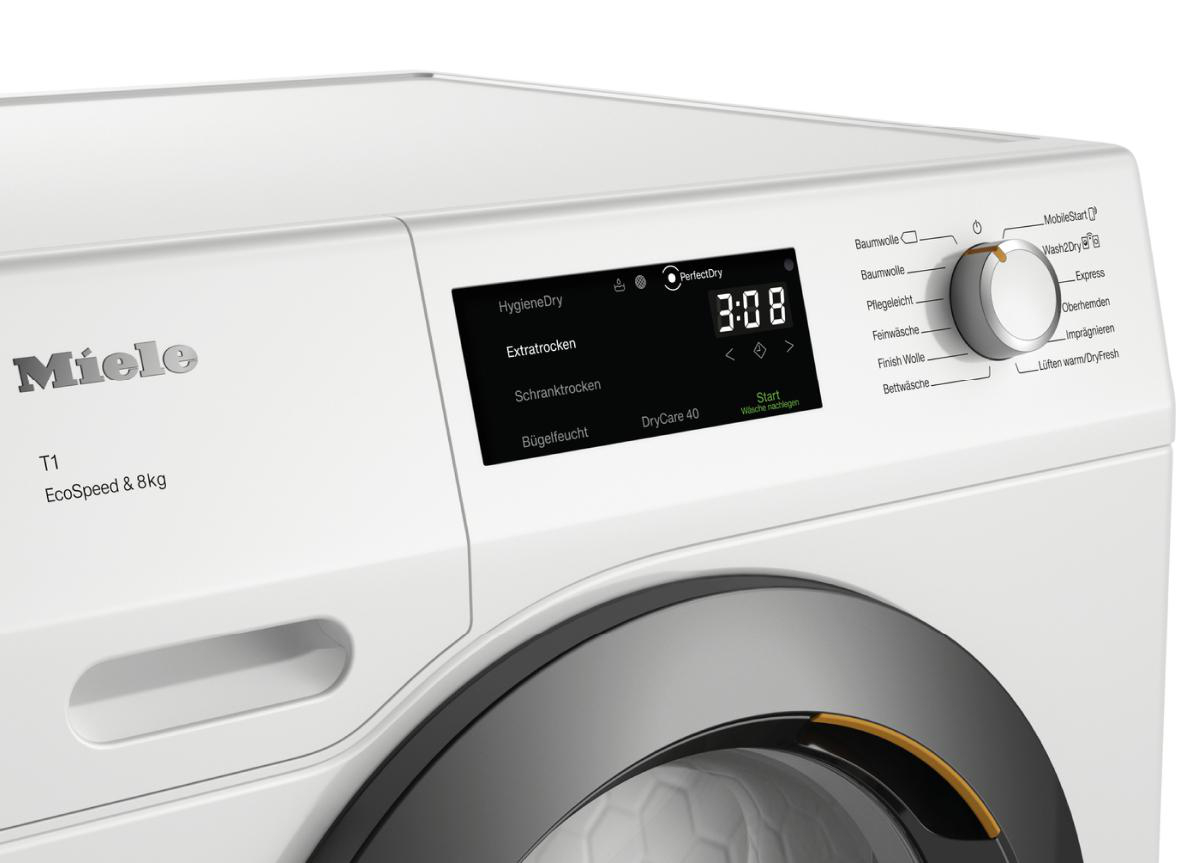 Nahaufnahme des Bedienfelds einer weißen Miele Waschmaschine mit Einstellungen und Anzeige.