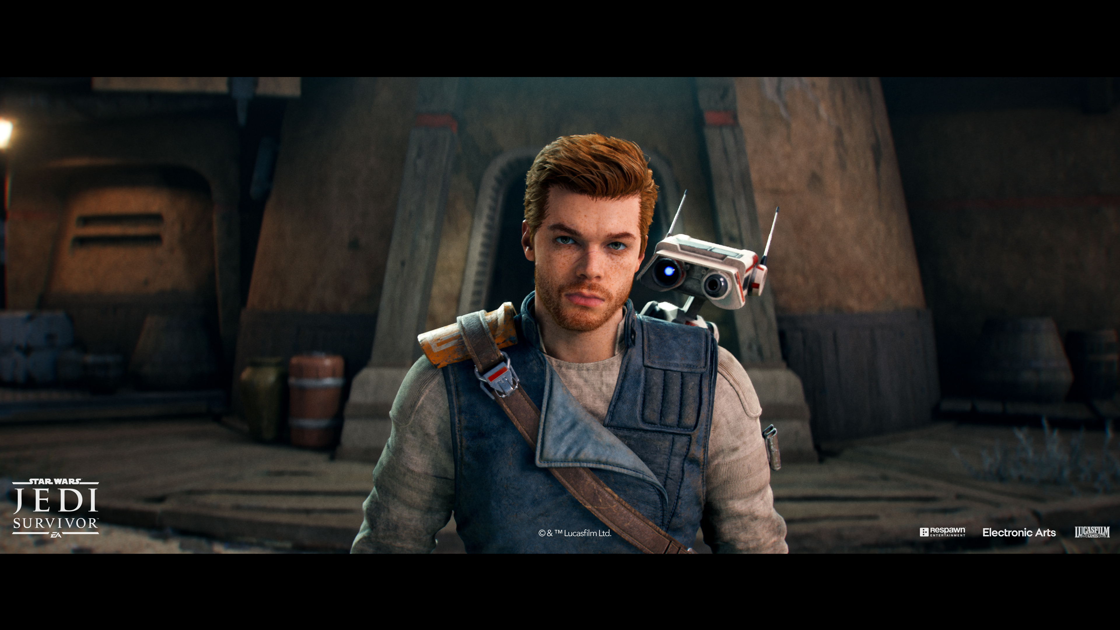Un homme aux cheveux roux et un compagnon robot dans une scène du jeu Star Wars.