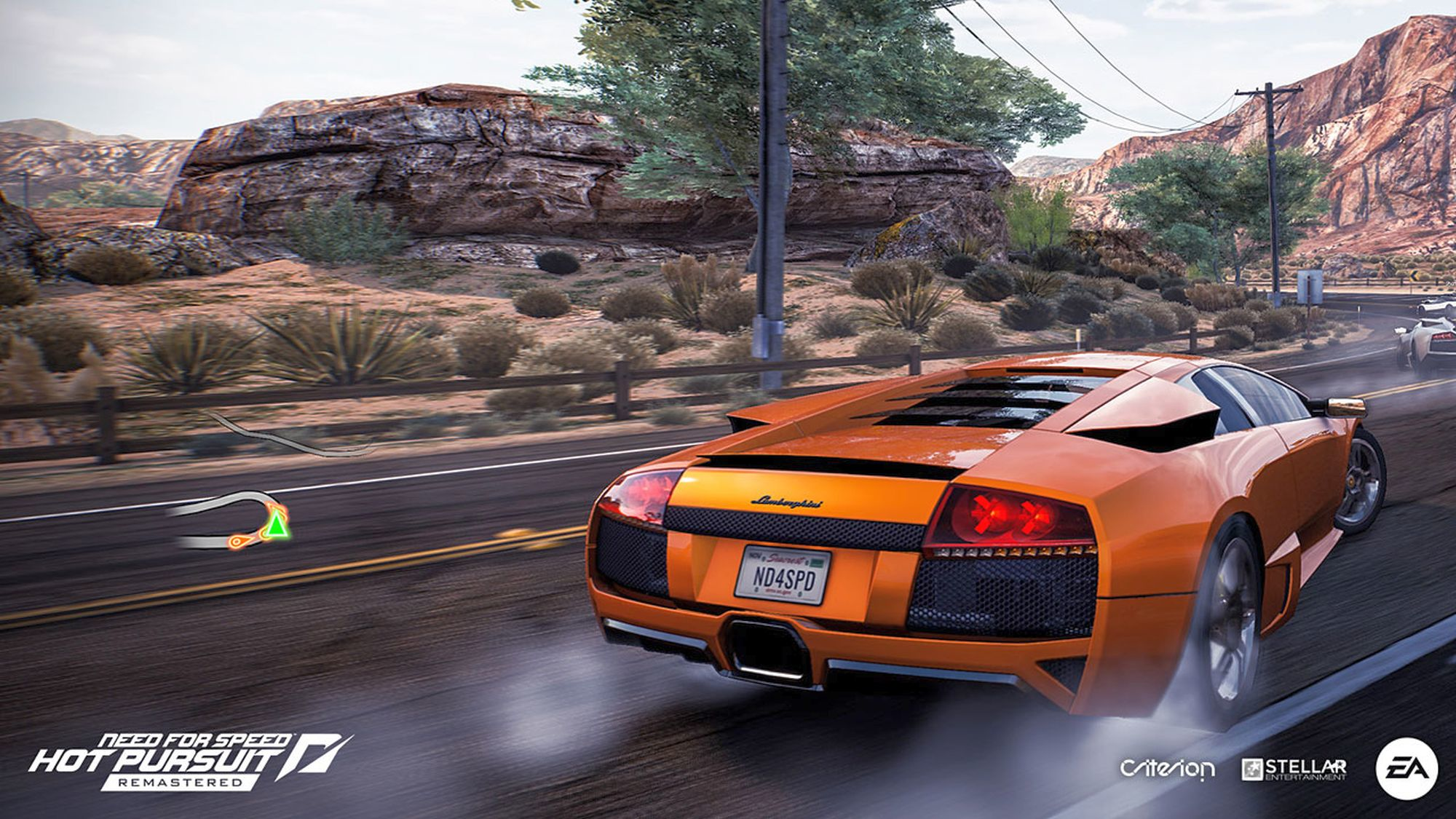 Lamborghini arancione in una scena del gioco 'Need for Speed' con montagne.