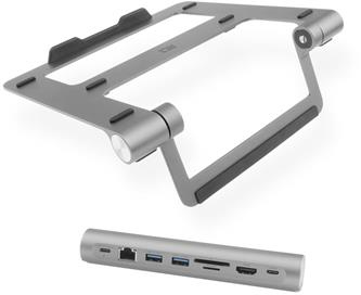 Silver laptop stand and a silver docking station, both positioned on white surface.